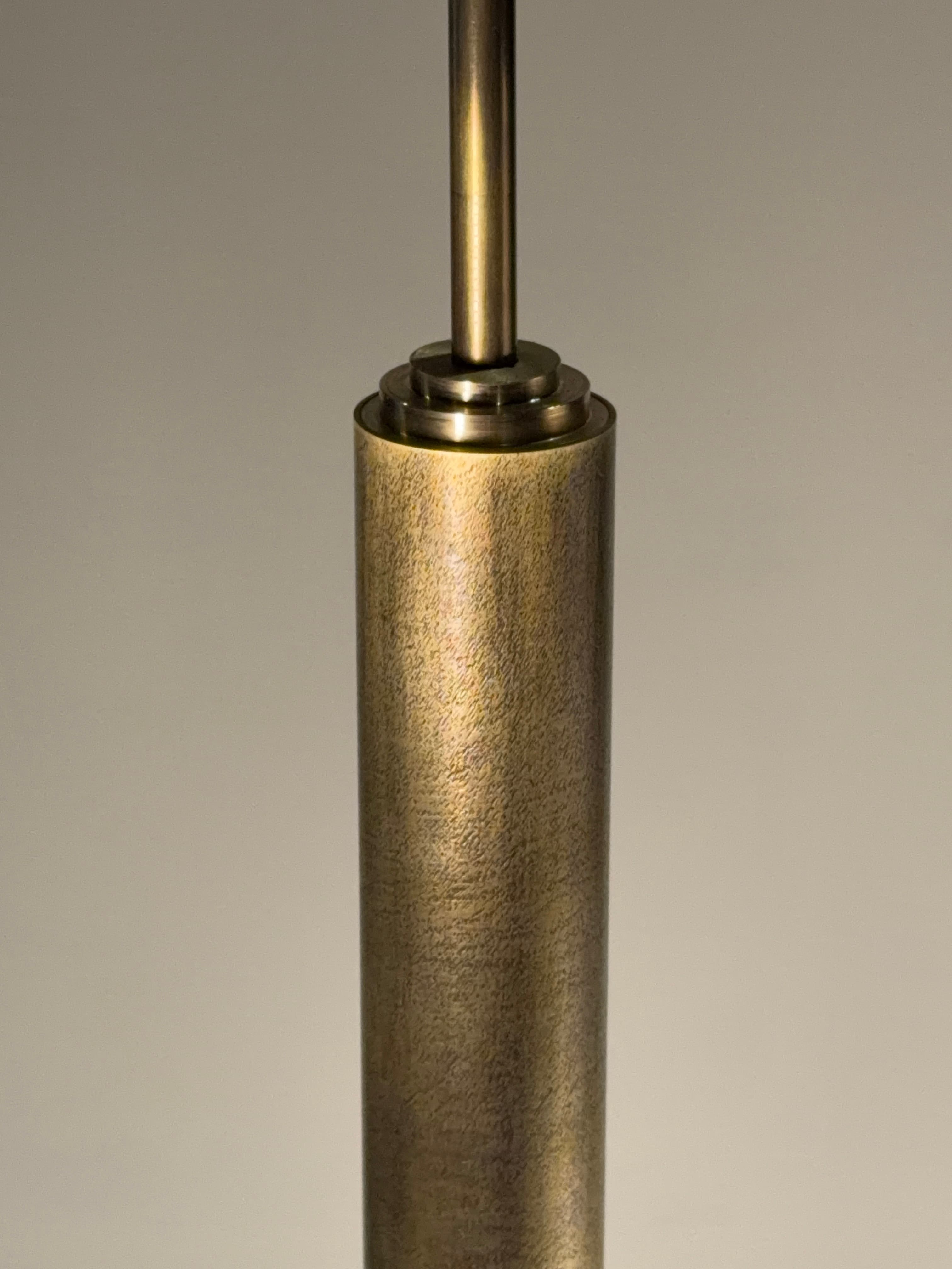 Textured metal suspension detail of the Glass Straw Pendant