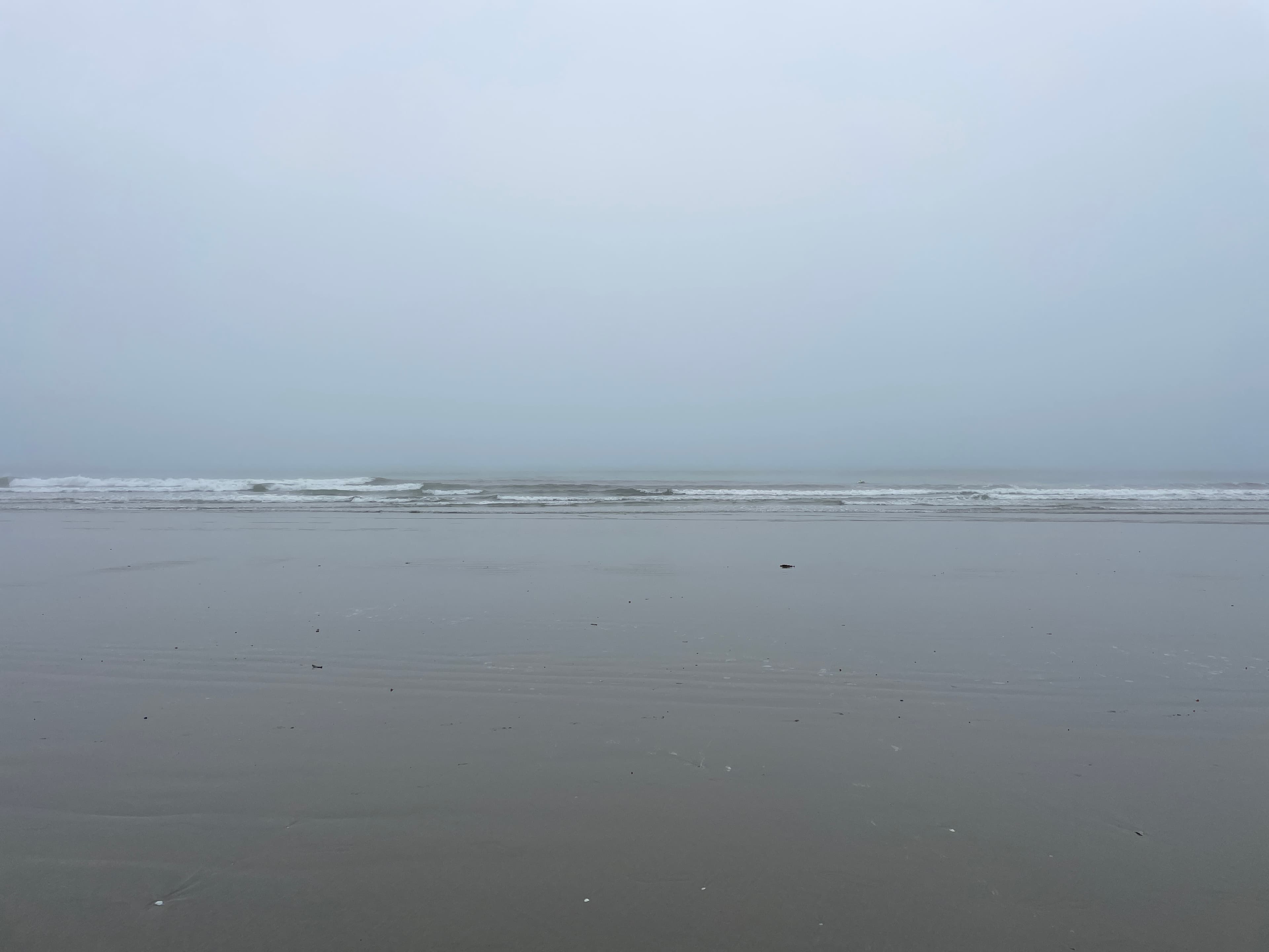 Misty Omaha beach and distant horizon